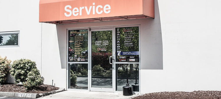 An image of the front door of a service shop.