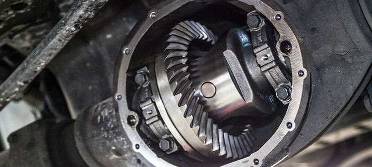 An image of gears in the bottom of a vehicle.